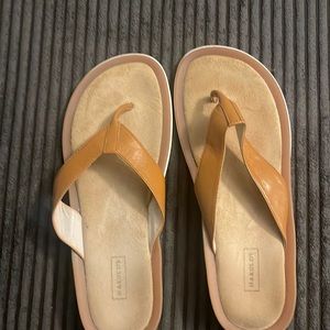 Harold’s comfortable flip flops.  Who remembers the Famous classic store?